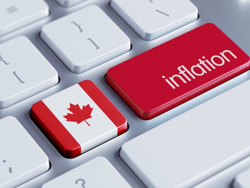 Un clavier d'ordinateur dont deux touches ont été changées. Une représente le drapeau canadien, l'autre est rouge et il est incrit "inflation" dessus.