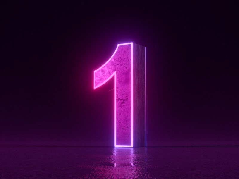 Numéro 1 avec néon lumineux sur fond noir.